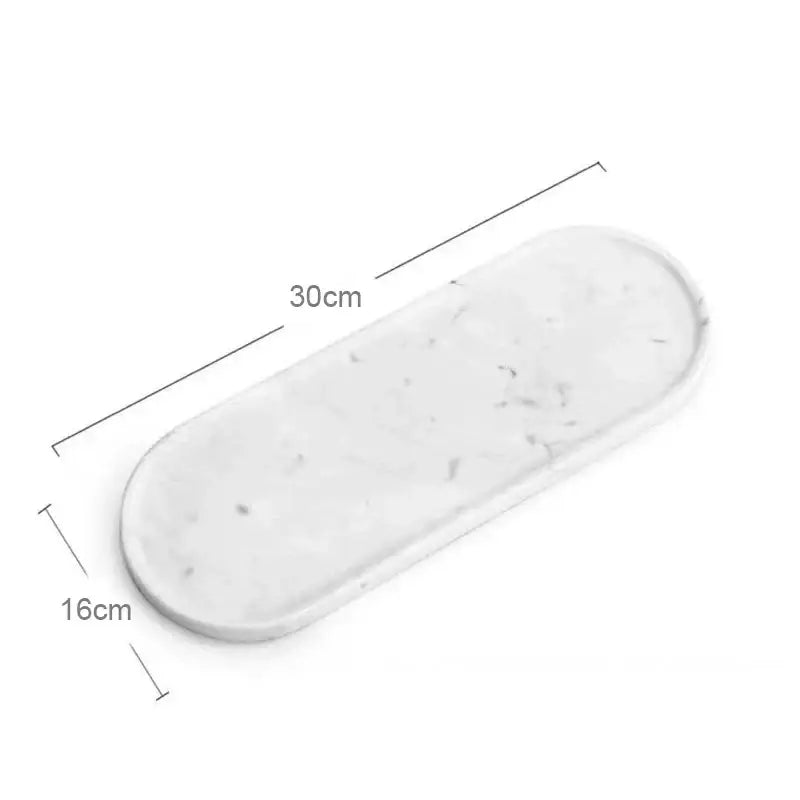 Oval white calacatta marble vanity tray with subtle gray veining and rounded edges for bathroom decorbites calacatta marble use