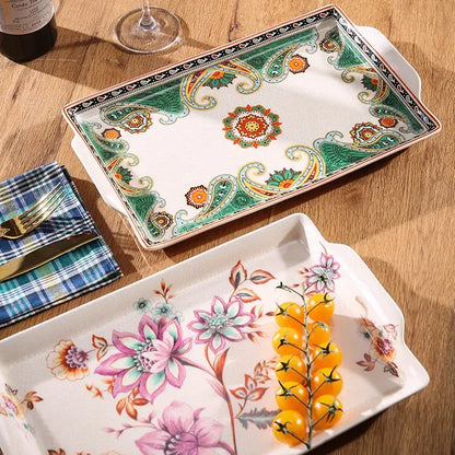 A rectangular ceramic ice crack tray with vibrant green and orange paisley pattern and handles by decorbites