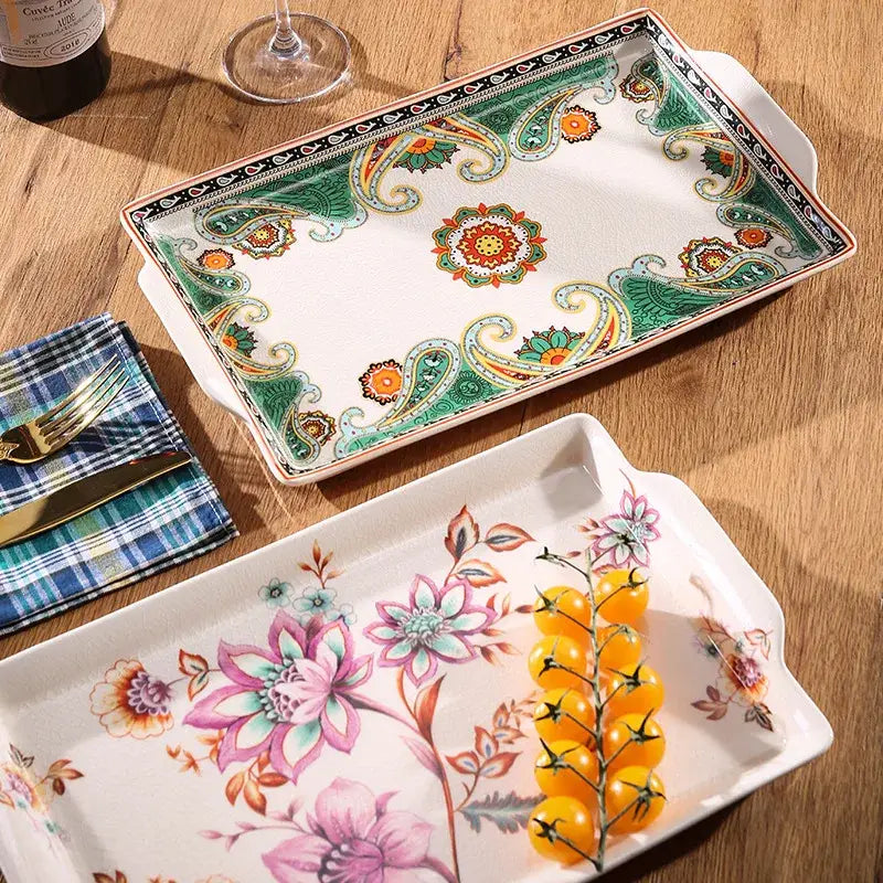 A rectangular ceramic ice crack tray with vibrant green and orange paisley pattern and handles by decorbites