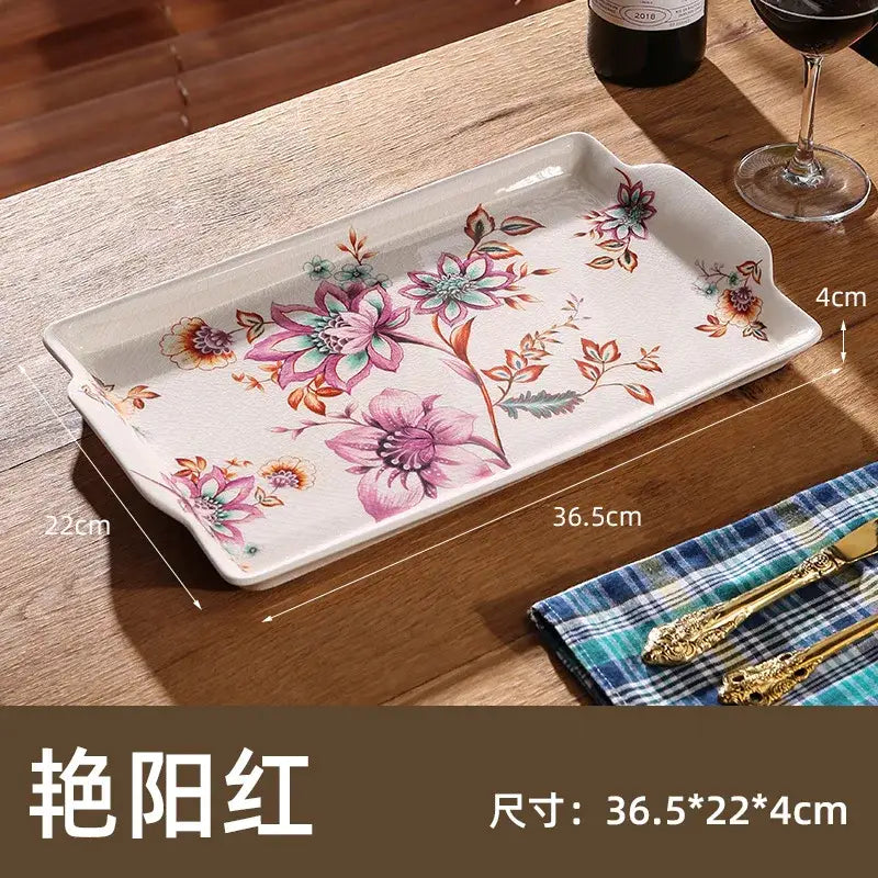 A rectangular ceramic ice crack tray with pink purple and green floral pattern for decorbites ice crack serving