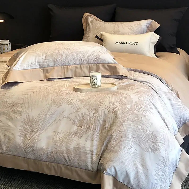 Beige and silver leaf-patterned egyptian cotton bedding set with matching pillowcases in palm leaf design