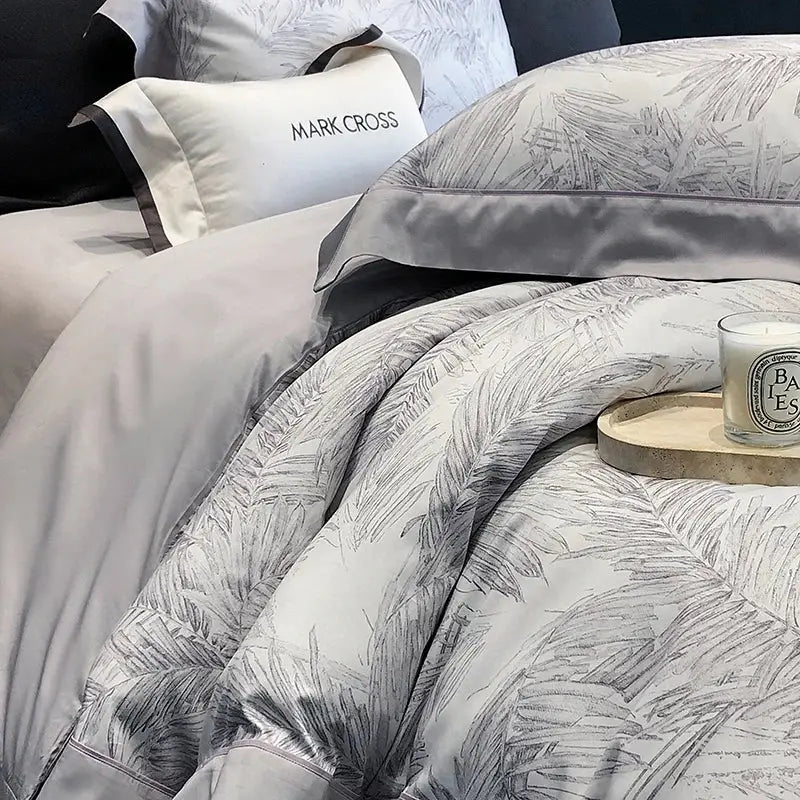 Gray satin pillowcase with black leaf pattern and dark gray piping from egyptian cotton bedding sets