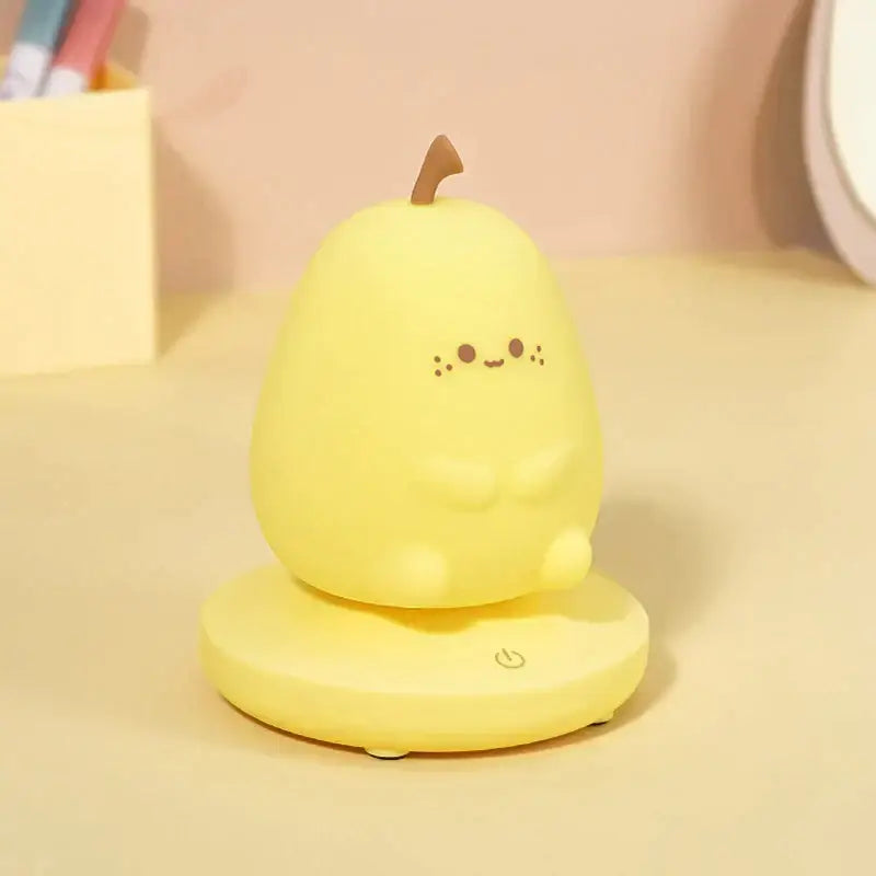A cute yellow pear-shaped night light with brown stem made of smooth plastic for decorbites kids animal silicone use