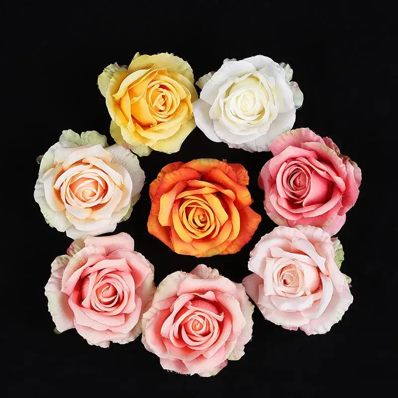 A collection of 30pcs silk roses in pastel and warm tones made from smooth glossy material for wedding decor