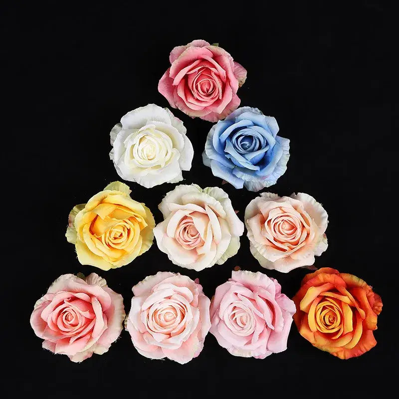 A collection of 30pcs silk roses in pastel and vibrant hues made from plush fabric for wedding and living room decor
