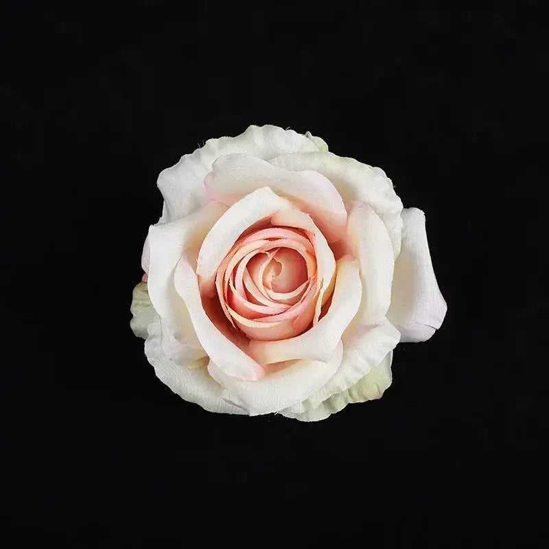A delicate blush pink and white silk rose with soft layered petals from pastel 30pcs silk roses wedding decor