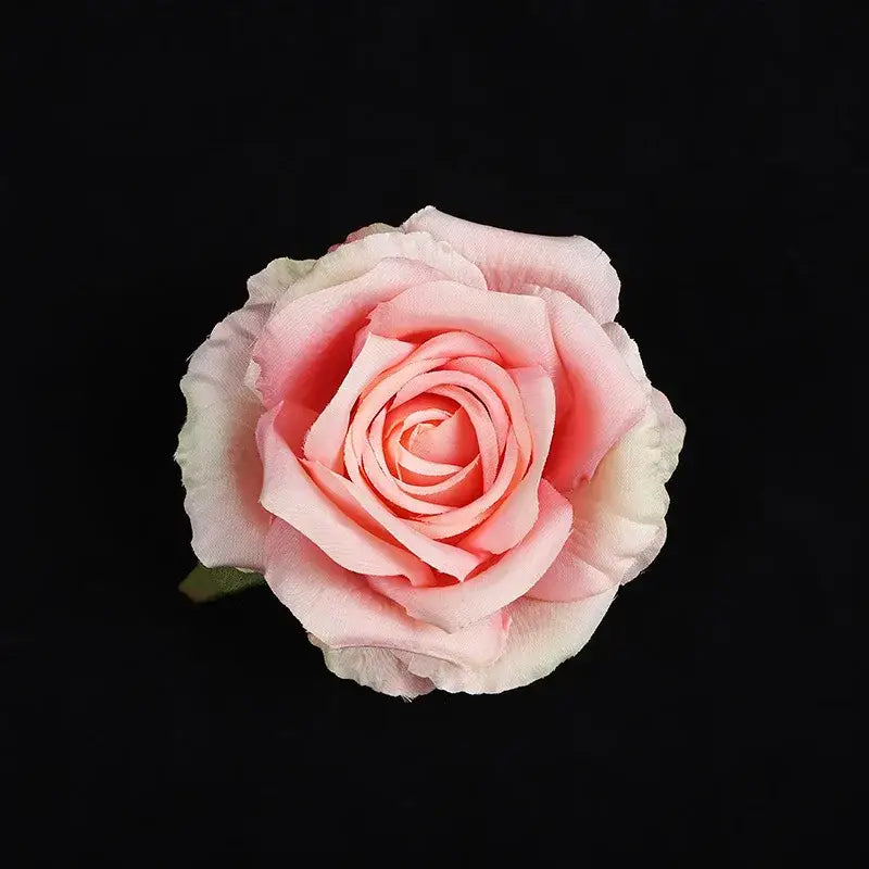 A delicate pink silk rose with layered petals from the pastel 30pcs silk roses set ideal for wedding decor