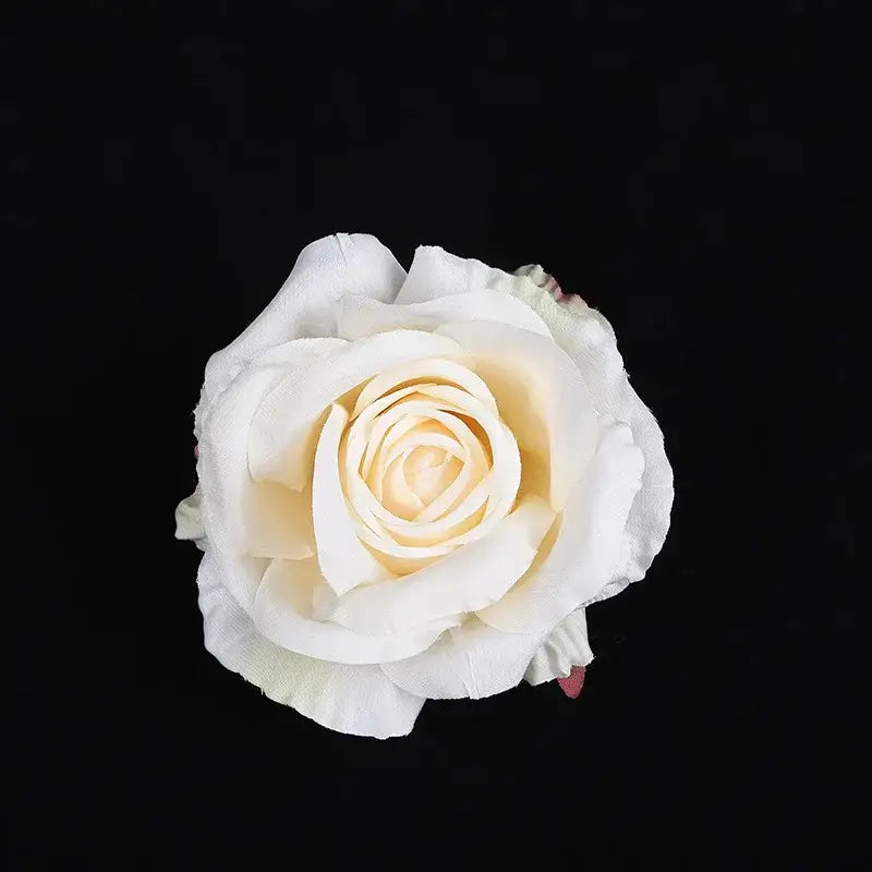 A delicate ivory silk rose with layered petals and a creamy yellow center from pastel 30pcs silk roses decor set