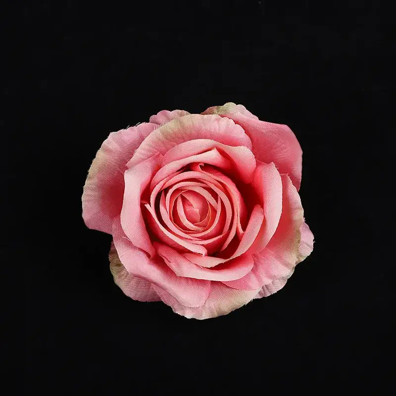 A delicate pink and cream silk rose from the pastel 30pcs silk roses set for wedding and living room decor