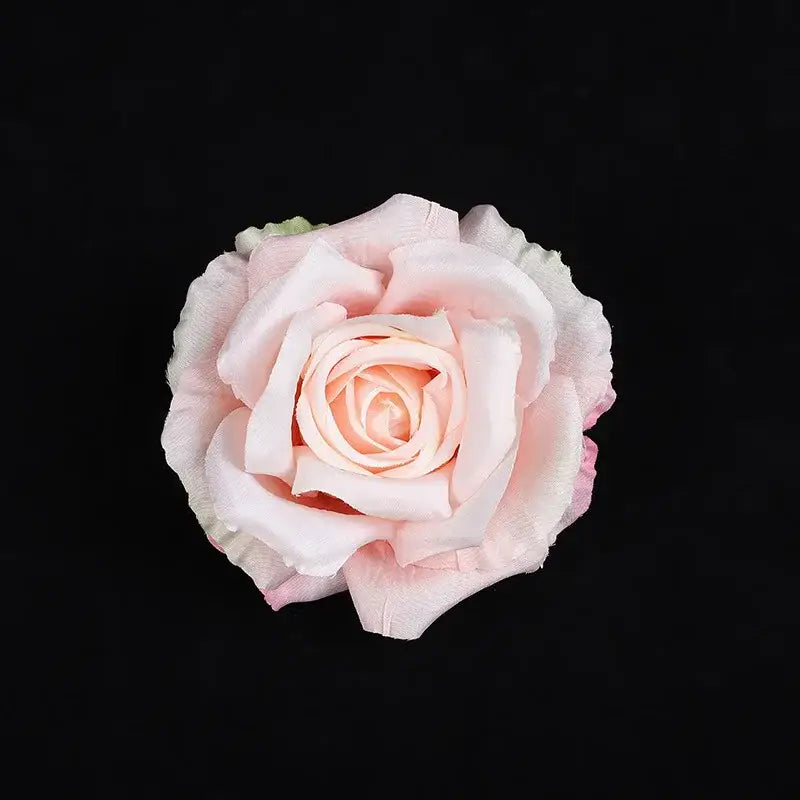 A delicate blush pink silk rose with layered petals from a pastel 30pcs silk roses set for wedding decor