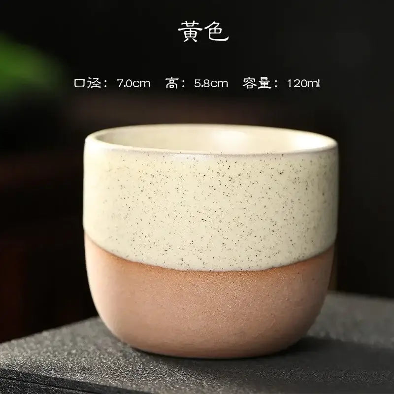 Pastel and terracotta ceramic tea cup set featuring a yellow two-tone glaze cup with speckled cream and matte terracotta