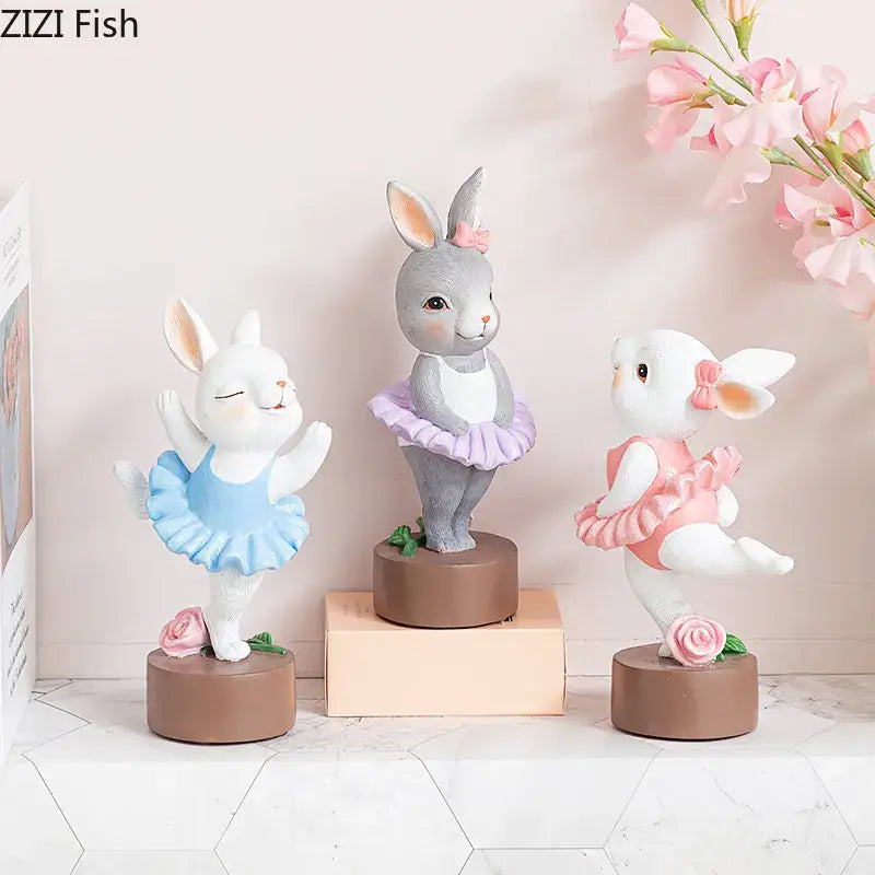 Three pastel ballet rabbit dancer sculptures in blue lavender and pink tutus for bedroom desk decor