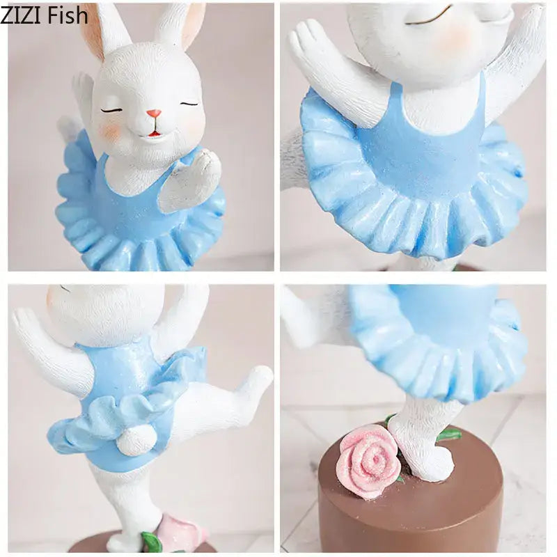 A white ceramic ballet rabbit dancer sculpture in a light blue leotard with ruffled skirt beside a pink rose