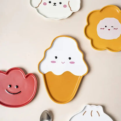 A cheerful yellow and white ice cream ceramic plate with a smiling face from decorbites cloud tulip cartoon dog tableware