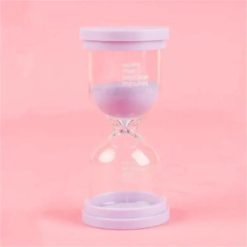 Lavender-colored hourglass sand timer with clear glass body and happy time print in pastel blue and pink timer set for kids
