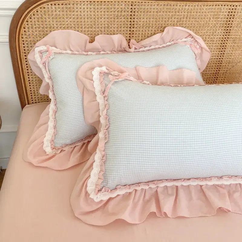Pastel blue and pink ruffled cotton pillowcases with subtle checkered pattern from decorbites blue pink lattice bedding set