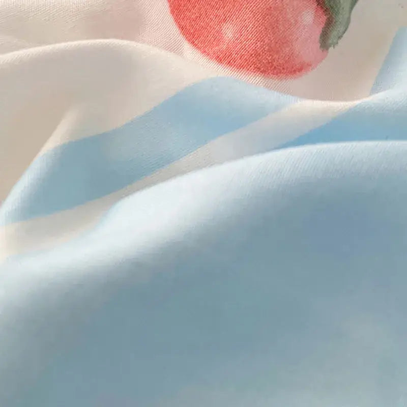 Pastel blue and white cotton bed sets featuring a soft striped fabric with subtle strawberry decorbites cartoon pattern