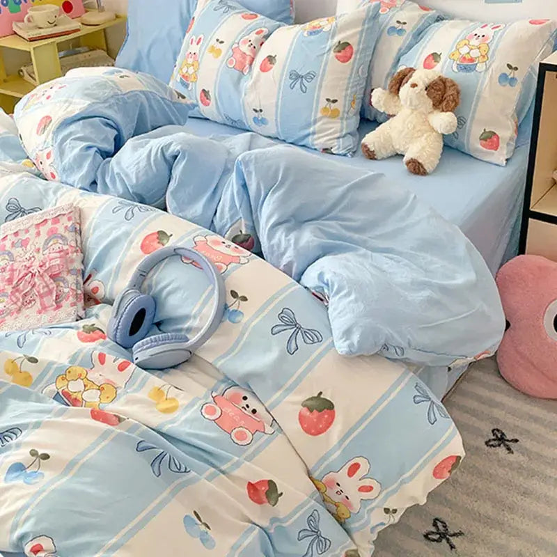 Pastel blue and white cotton bed sets featuring a decorbites cartoon pattern with rabbits cherries and bows