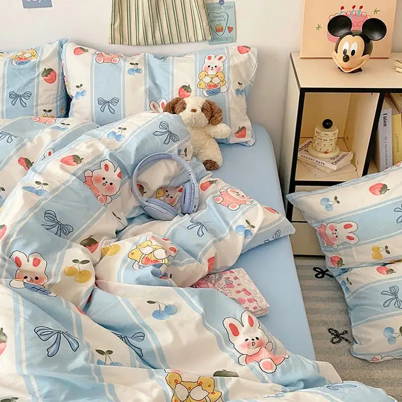 Pastel blue and white bed sets featuring decorbites cartoon pattern of bunnies cherries and bows in soft cotton fabric