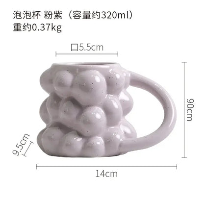 A matte pastel purple grape ceramic mug with textured bubbly surface and speckled finish decorbites grape ceramic cup