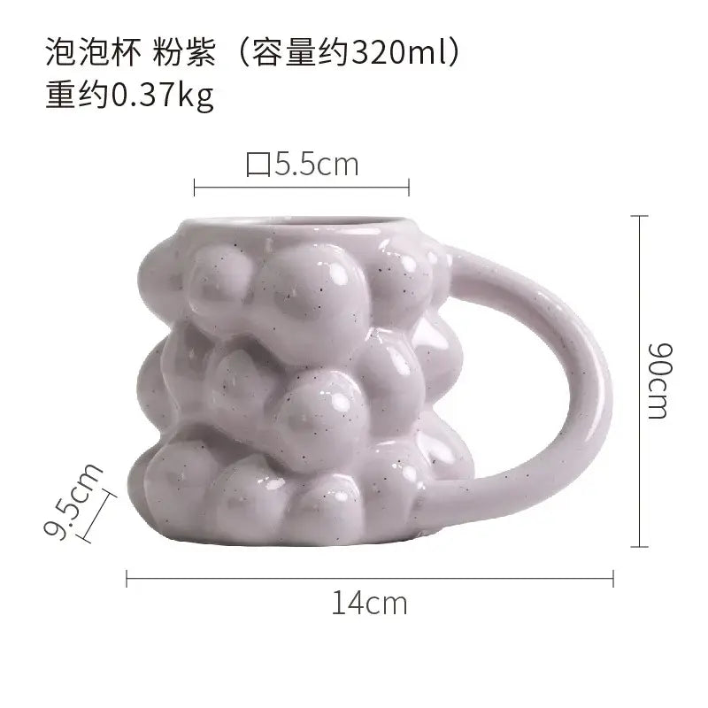 A matte pastel purple grape ceramic mug with textured bubbly surface and speckled finish decorbites grape ceramic cup