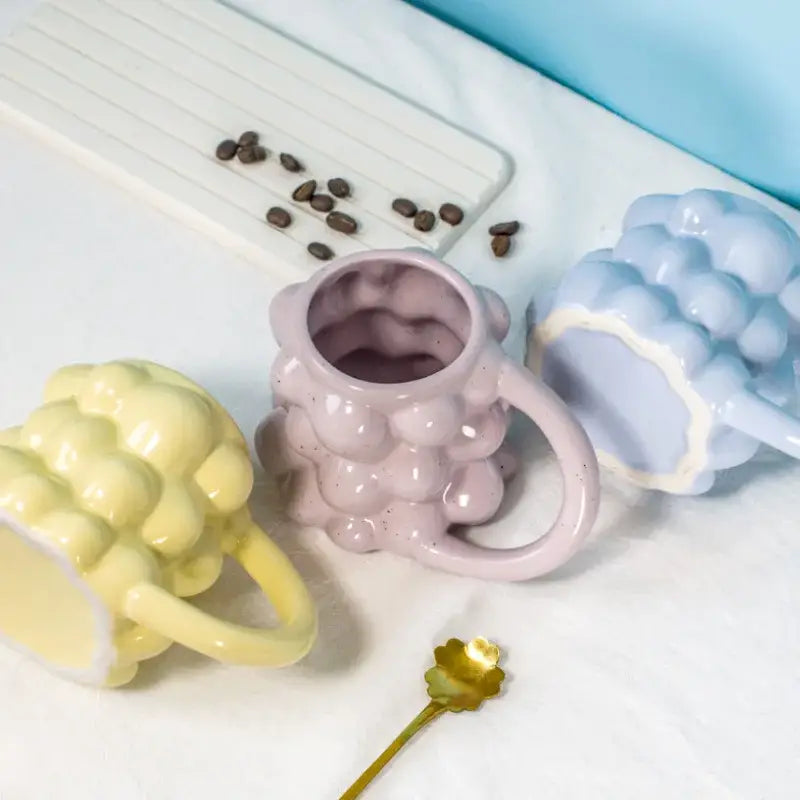 Pastel pink ceramic mug with textured bubbly surface and matching handle decorbites grape ceramic mug for kitchen use