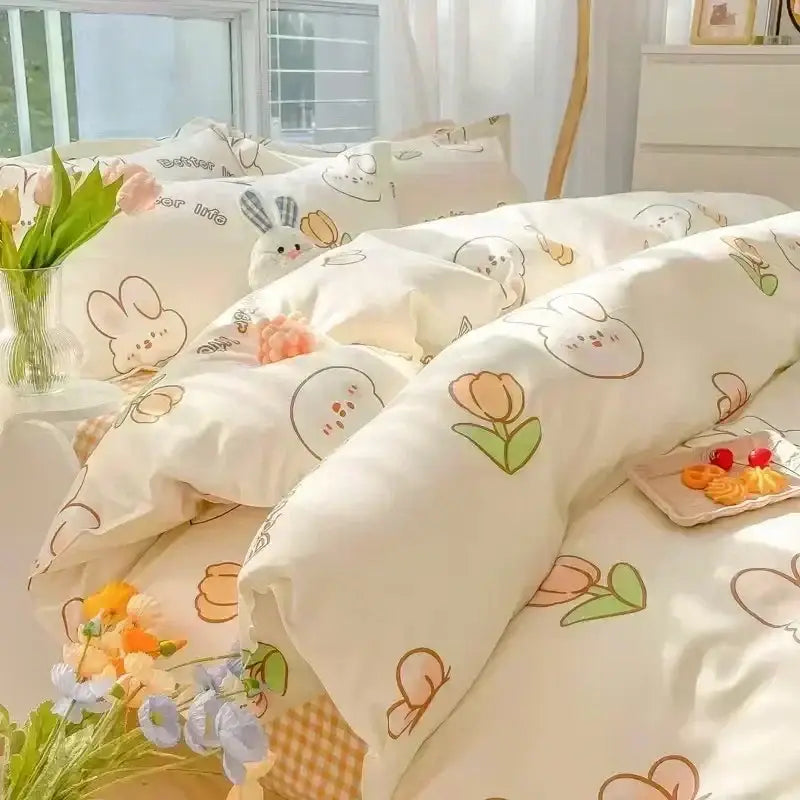 Cute cream-colored bedding set with pastel peach and green decorbites cartoon print featuring bunny and tulip prints