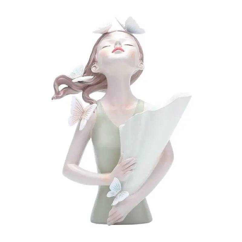 A delicate porcelain butterfly girl figurine in pale green dress with white butterflies for flower vase decor