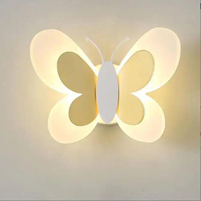 A pastel butterfly girl room lamp with translucent wings and warm glowing white body by decorbites butterfly girl decor