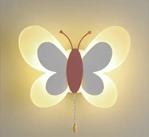 A pastel butterfly girl room lamp wall sconce with soft glowing translucent white wings and maroon body decorbites butterfly girl