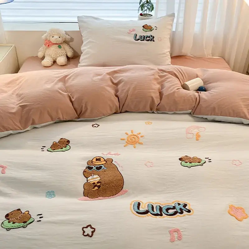 Cozy cream-colored cotton bedding set with decorbites cartoon embroidered bears suns and the word luck in playful design