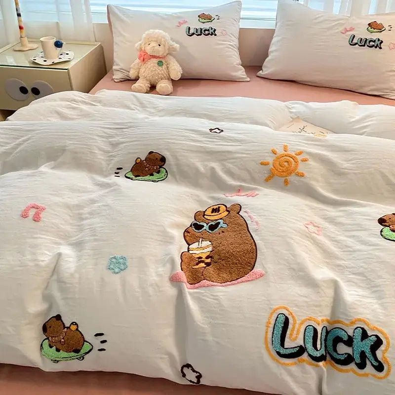 White cotton bedding set with pastel cartoon embroidered brown bears sun motifs and colorful luck lettering decorbites cartoon embroidered