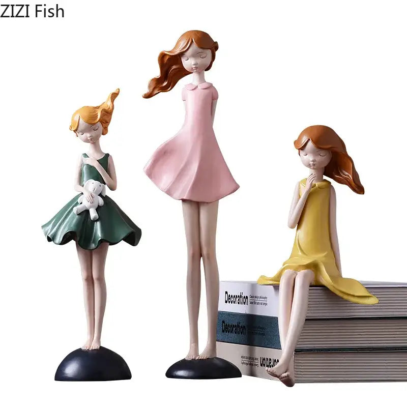 Three pastel-colored girl resin sculptures in pink green and yellow as decorbites cartoon girl bedroom desk ornaments