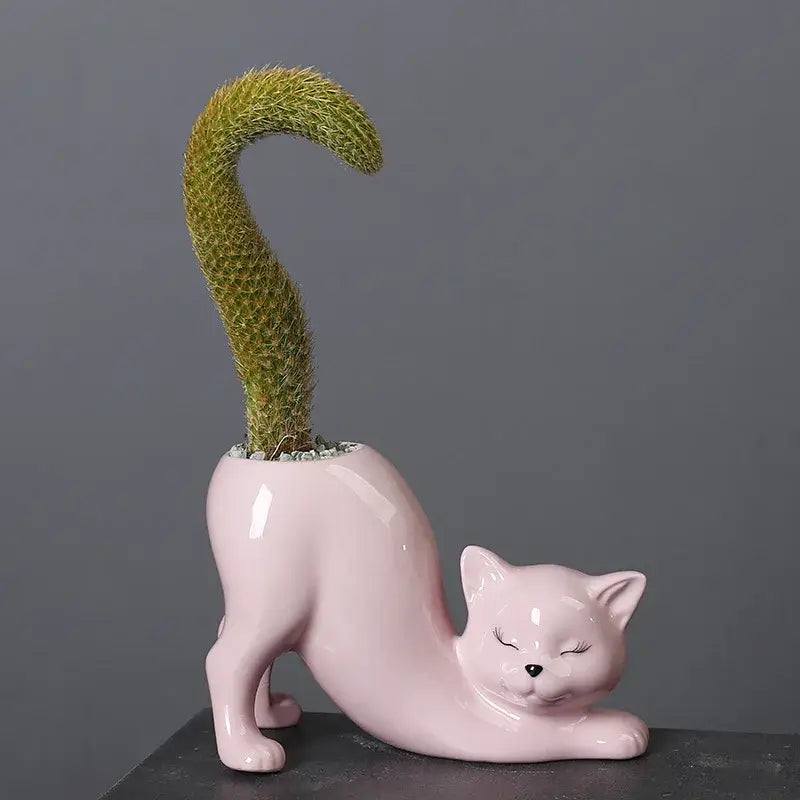 Pink pastel ceramic cat tail succulent planter featuring a curved green cactus for bedroom decorbites cat tail decor