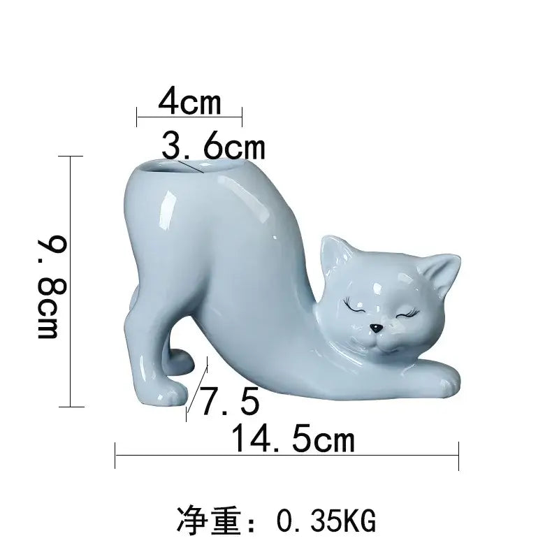 A smooth light blue pastel ceramic cat tail succulent planter with closed eyes and glossy finish for bedroom decorbites decor