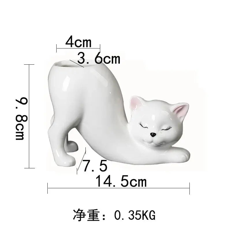 White ceramic cat tail succulent planter with closed eyes and pink ears in a stretching pose for bedroom decorbites cat tail decor