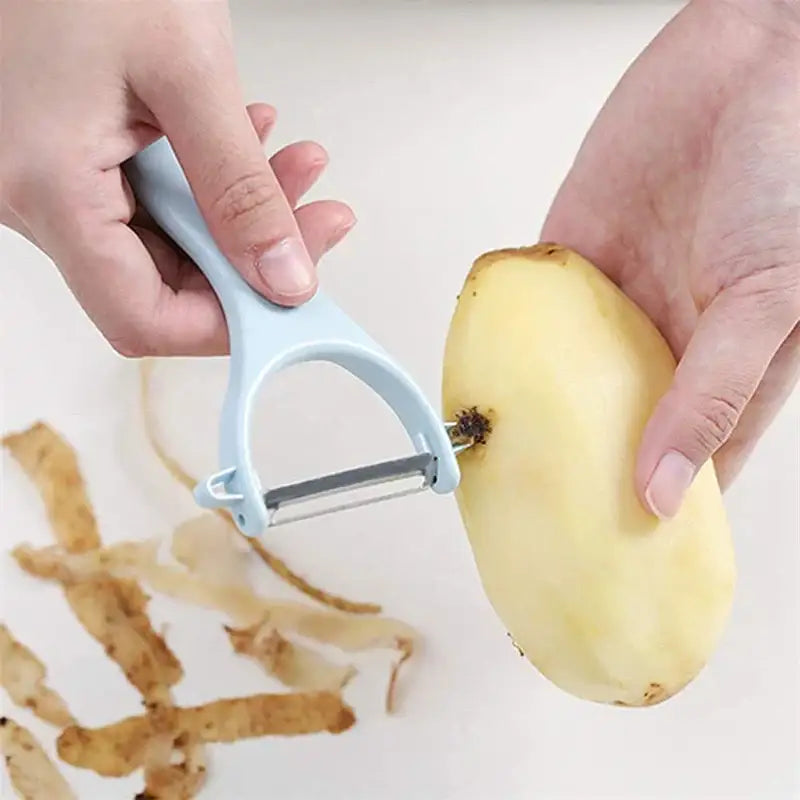 Light blue plastic-handled ceramic kitchen peeler with stainless steel blade from decorbites ceramic kitchen set