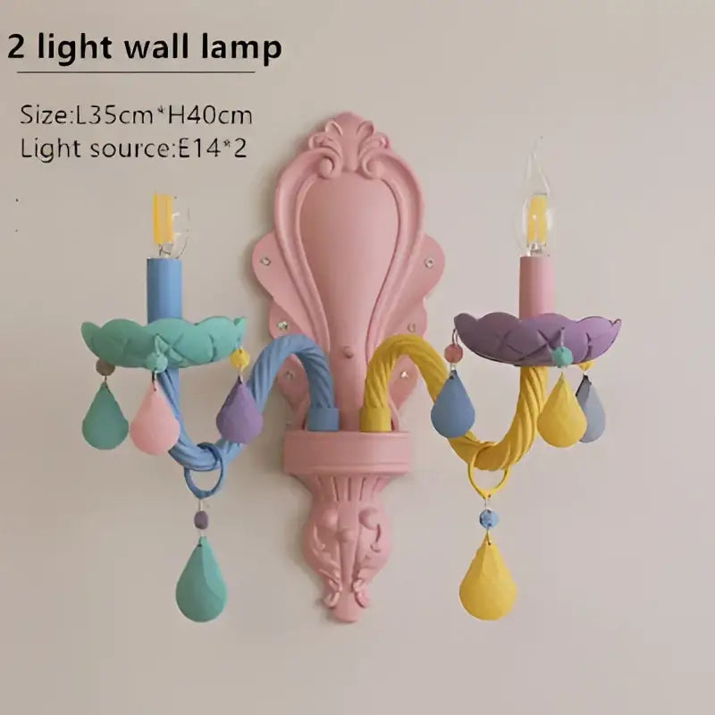 Pastel pink ornate wall sconce with colorful crystal cartoon led bulbs and teardrop pendants for kids bedroom decorbites colorful crystal