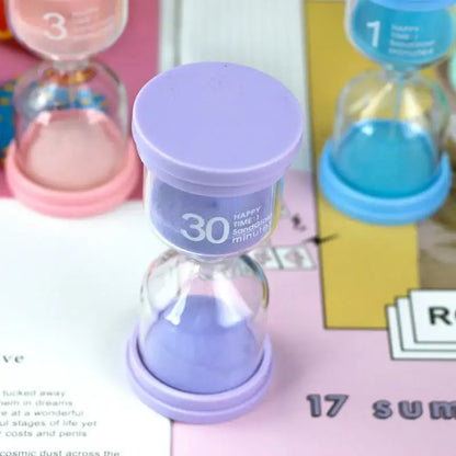 Purple 30-minute sand timer with lavender sand and smooth plastic base in pastel colorful decorbites hourglass sand set for kids bedroom