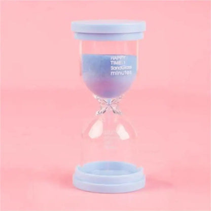Pastel colorful glass hourglass sand timer with gradient purple to pink sand and blue plastic caps for kids bedroom decorbites hourglass sand