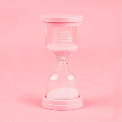 Pink glass hourglass sand timer with white sand and matching lid from decorbites hourglass sand set for kids bedroom decor