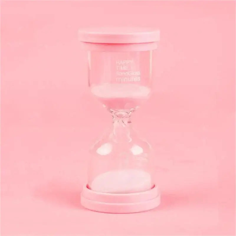Pink glass hourglass sand timer with white sand and matching lid from decorbites hourglass sand set for kids bedroom decor