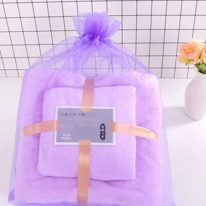Pastel coral velvet bath towel set in soft lavender color wrapped in purple organza with gold ribbon decorbites coral velvet
