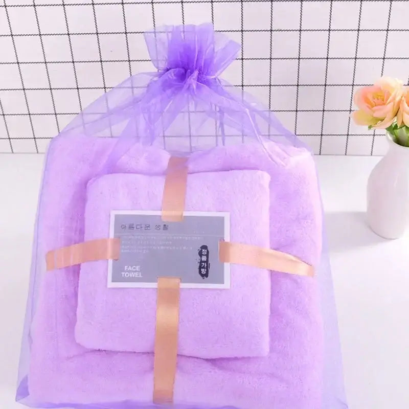 Pastel coral velvet bath towel set in soft lavender color wrapped in purple organza with gold ribbon decorbites coral velvet
