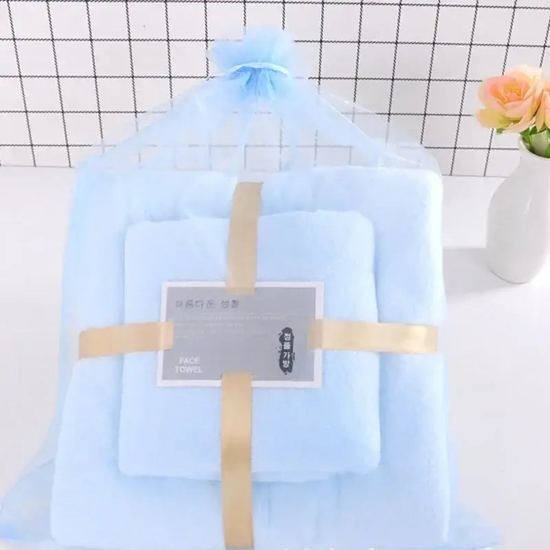 Pastel coral velvet bath towel set with light blue plush velvet bath towel wrapped in gold ribbon decorbites coral velvet
