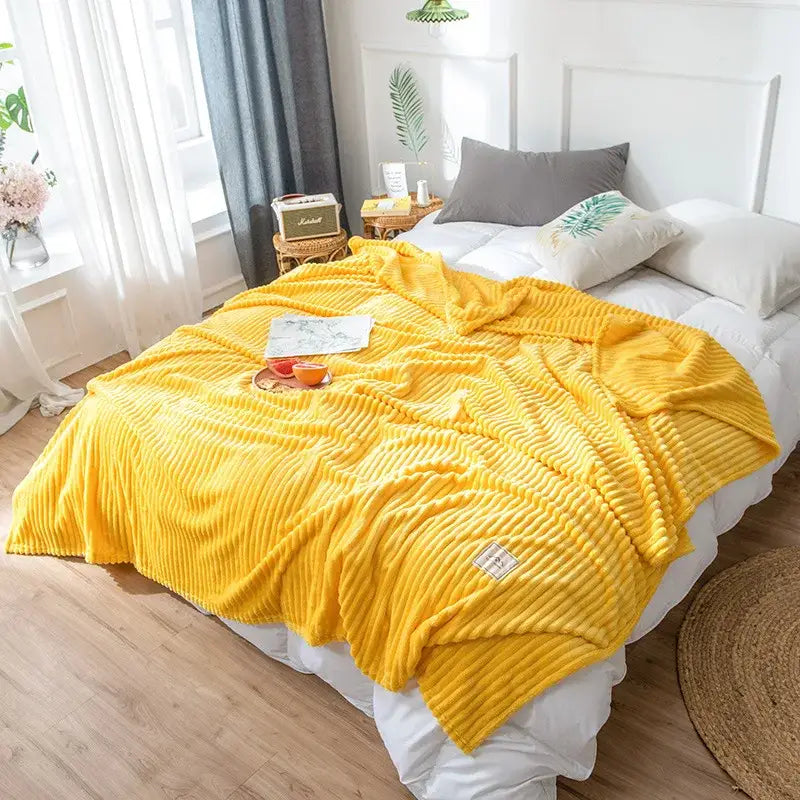 Bright yellow ribbed cozy hug blanket with soft plush texture and small woven label by decorbites soft sweatshirt throw