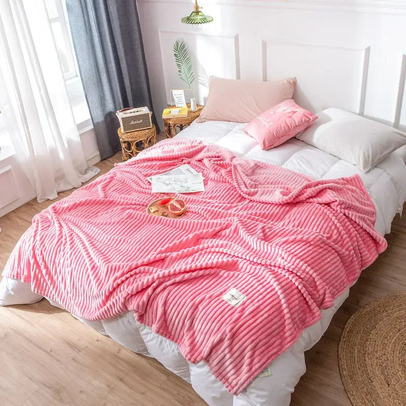Pink ribbed fleece decorbites cozy hug blanket with soft plush texture and subtle vertical ridges perfect as a soft sweatshirt throw
