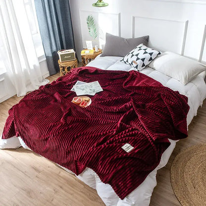A plush deep red corduroy cozy hug blanket with ribbed texture and woven label for decorbites soft sweatshirt throw