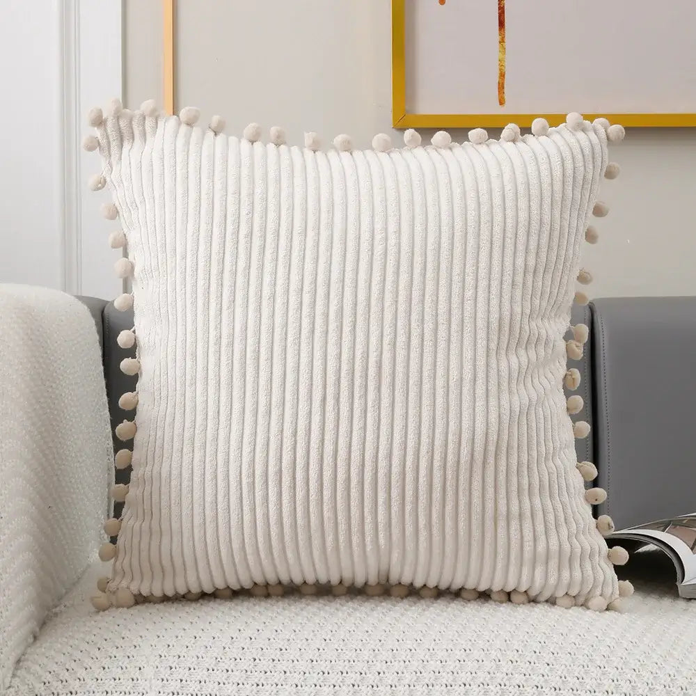 Cream-colored corduroy pompom cushion cover with soft fluffy pom-poms along edges for living room decorbites decor
