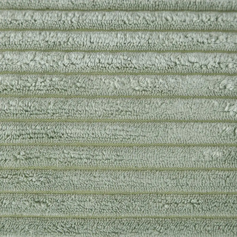 Soft sage green terry cloth towel with ribbed texture and faint stripes complementing decorbites corduroy pompom cushion cover